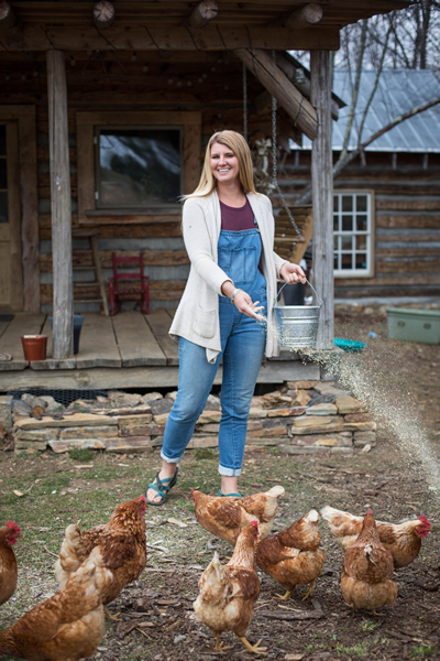 feeding chickens with galvanized bucket